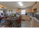 Bright kitchen and breakfast nook with stainless steel appliances and light wood cabinetry at 15279 Sugargrove Way, Orlando, FL 32828