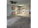 Open kitchen and dining area with oak cabinetry and white appliances at 15279 Sugargrove Way, Orlando, FL 32828