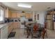 Well-lit kitchen with stainless steel appliances, an eat-in dining table, and ample storage at 15279 Sugargrove Way, Orlando, FL 32828