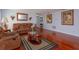 Inviting living room with hardwood floors, comfortable seating, and decorative accents at 15279 Sugargrove Way, Orlando, FL 32828