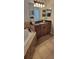 Bathroom vanity with double sinks and wood cabinets next to a soaking tub at 1530 Lexington Av Ave, Davenport, FL 33837