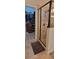 Bathroom featuring glass shower, neutral tile, and an open doorway to closet at 1530 Lexington Av Ave, Davenport, FL 33837