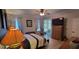 Relaxing bedroom with a ceiling fan, large windows, and a cozy atmosphere at 1530 Lexington Av Ave, Davenport, FL 33837