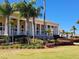 Beautiful clubhouse exterior featuring manicured landscaping and inviting architecture with large, white columns at 1530 Lexington Av Ave, Davenport, FL 33837