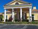 Beautiful clubhouse featuring stately columns, manicured landscaping, and classic architectural details at 1530 Lexington Av Ave, Davenport, FL 33837