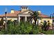 Beautiful yellow clubhouse with manicured landscaping and a tile roof at 1530 Lexington Av Ave, Davenport, FL 33837