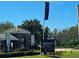Beautiful entrance to Hampton Green at Providence, featuring golf course homes and upscale community signage at 1530 Lexington Av Ave, Davenport, FL 33837
