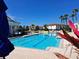 A community pool with lounge chairs and umbrellas on a sunny day, perfect for relaxation at 1530 Lexington Av Ave, Davenport, FL 33837