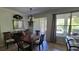 Traditional dining room with modern chandelier, and views of the outdoor patio and BBQ grill at 1530 Lexington Av Ave, Davenport, FL 33837