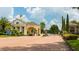 Gated entrance with manicured landscaping at the entrance to the community at 1530 Lexington Av Ave, Davenport, FL 33837
