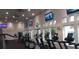Modern fitness center featuring various cardio machines, TVs, and ample natural light for a healthy lifestyle at 1530 Lexington Av Ave, Davenport, FL 33837