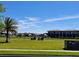 View of golf course with houses in the background and golf carts on the green at 1530 Lexington Av Ave, Davenport, FL 33837