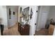 Hallway featuring decorative accents, a wooden dresser, and views into adjacent rooms at 1530 Lexington Av Ave, Davenport, FL 33837