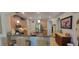 A well-lit kitchen features wooden cabinets, stainless steel appliances and barstool seating at the counter at 1530 Lexington Av Ave, Davenport, FL 33837