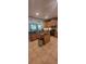 An open kitchen showcases stainless steel appliances, an island, granite countertops and ample cabinet space at 1530 Lexington Av Ave, Davenport, FL 33837
