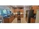 Well-lit kitchen features stainless steel appliances, an island, and plenty of cabinet space at 1530 Lexington Av Ave, Davenport, FL 33837