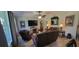 Spacious living room includes comfortable seating, entertainment center, and natural light at 1530 Lexington Av Ave, Davenport, FL 33837