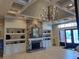 Lobby featuring coffered ceilings, fireplace with stone surround, and built-in shelving at 1530 Lexington Av Ave, Davenport, FL 33837