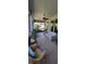 Relaxing screened porch with comfortable seating, a ceiling fan, and views of the surrounding greenery at 1530 Lexington Av Ave, Davenport, FL 33837