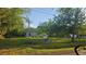 Home exterior with a fenced yard and mature trees, offering a sense of privacy at 18168 Cedarhurst Rd, Orlando, FL 32820