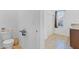 Bathroom featuring tile flooring, a toilet, and vanity with granite countertops at 1932 Red Canyon Dr, Kissimmee, FL 34744