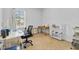 Cozy bedroom with carpet, large window, desk, chair and shelving unit at 1932 Red Canyon Dr, Kissimmee, FL 34744
