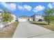Charming single-story home with a two-car garage and a long driveway at 1932 Red Canyon Dr, Kissimmee, FL 34744