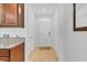 Bright hallway featuring tile flooring leading to the front door at 1932 Red Canyon Dr, Kissimmee, FL 34744