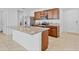 Kitchen with granite island, stainless steel appliances, and dark wood cabinetry at 1932 Red Canyon Dr, Kissimmee, FL 34744