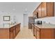 Spacious kitchen with granite countertops, stainless steel appliances, and tile flooring at 1932 Red Canyon Dr, Kissimmee, FL 34744