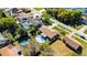 Aerial view of a home with a well-manicured lawn, swimming pool, and outdoor living space at 2072 Monterey Dr, Deltona, FL 32738