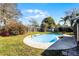 Backyard featuring an in-ground pool and grass at 2072 Monterey Dr, Deltona, FL 32738