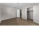 The bedroom features wood floors, modern ceiling fan, and a walk-in closet at 2072 Monterey Dr, Deltona, FL 32738