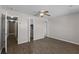 The cozy bedroom features hardwood floors, a ceiling fan, and a walk-in closet at 2072 Monterey Dr, Deltona, FL 32738