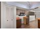 Kitchen featuring wood cabinets, orange countertops, microwave, and pantry at 2072 Monterey Dr, Deltona, FL 32738