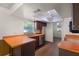 Bright kitchen with stainless steel appliances, wood cabinets, and orange countertops at 2072 Monterey Dr, Deltona, FL 32738