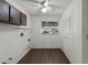 Laundry room with a window, utility sink hookup, built-in cabinets, and folding area at 2072 Monterey Dr, Deltona, FL 32738