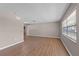 Spacious living room with laminate flooring and a large window at 2072 Monterey Dr, Deltona, FL 32738