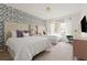 Stylish bedroom with two beds, floral wallpaper, and natural light at 2320 Lelani Cir, Davenport, FL 33897