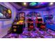 Unique game room with arcade machines and galaxy-themed decorations at 2320 Lelani Cir, Davenport, FL 33897