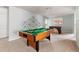 Game room featuring a billiards table, foosball, and contemporary decor at 2320 Lelani Cir, Davenport, FL 33897