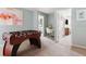 Fun game room with foosball table, white desk, and bright flamingo-themed art at 2320 Lelani Cir, Davenport, FL 33897