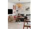Cozy living room with flamingo wall art, patterned rug, and comfortable seating arrangement at 2320 Lelani Cir, Davenport, FL 33897