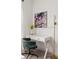 Bright home office with modern white desk and colorful abstract art at 2320 Lelani Cir, Davenport, FL 33897
