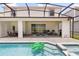 A beautiful swimming pool and spa with patio dining at 2320 Lelani Cir, Davenport, FL 33897