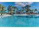 Enjoy the spacious community pool with plenty of lounge chairs at 2320 Lelani Cir, Davenport, FL 33897