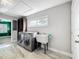 This laundry room features a washer, dryer, large utility sink, window, and cabinet, perfect for household chores at 2405 Dellwood Dr, Orlando, FL 32806