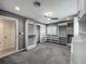 Large walk-in closet with custom shelving, drawers, a ceiling fan, and gray carpeting at 2405 Dellwood Dr, Orlando, FL 32806