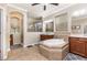 Bathroom features a large tub, separate shower, dual sinks, and plenty of counter space at 2731 Cypress Tree Trl, St Cloud, FL 34772