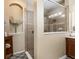 This bathroom offers a tiled shower with a glass enclosure and neutral-toned walls at 2731 Cypress Tree Trl, St Cloud, FL 34772